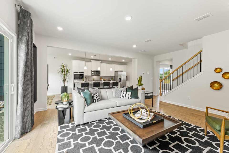 A living room with a couch and a table.