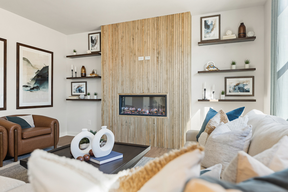 A living room with a couch and a table.