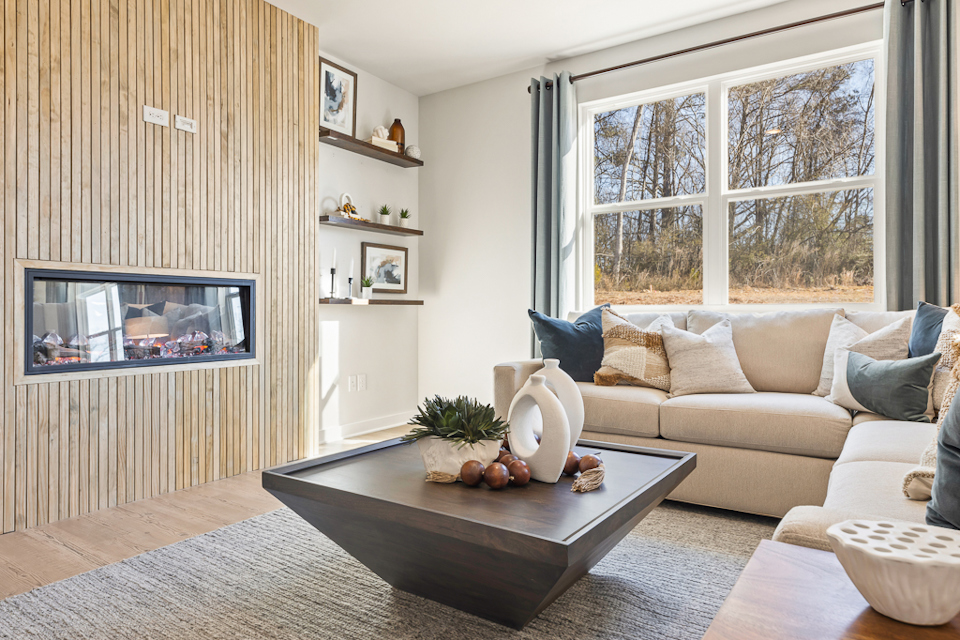 A living room with a fireplace.