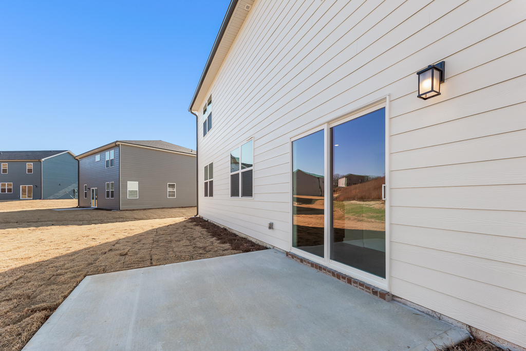 A white building with a glass door.