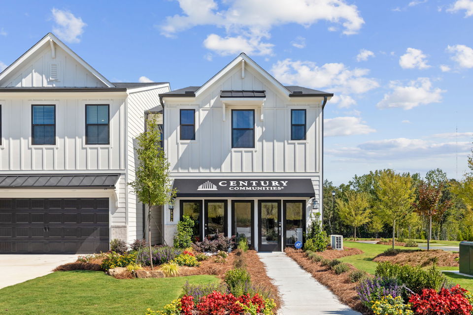 A white building with a sign on it.