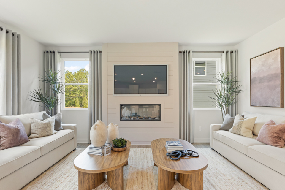A living room with a fireplace.