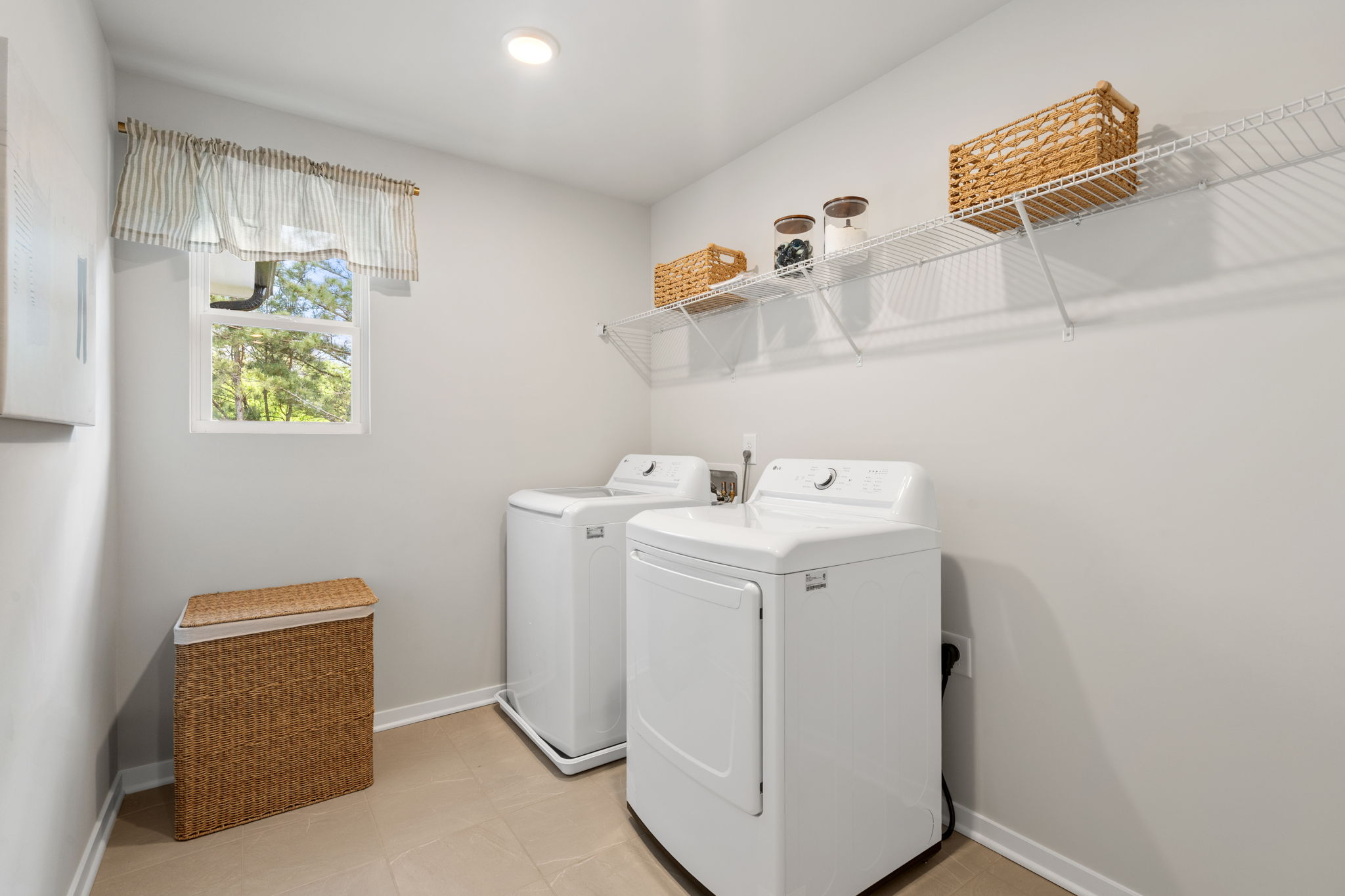 A laundry room with a washer and dryer.