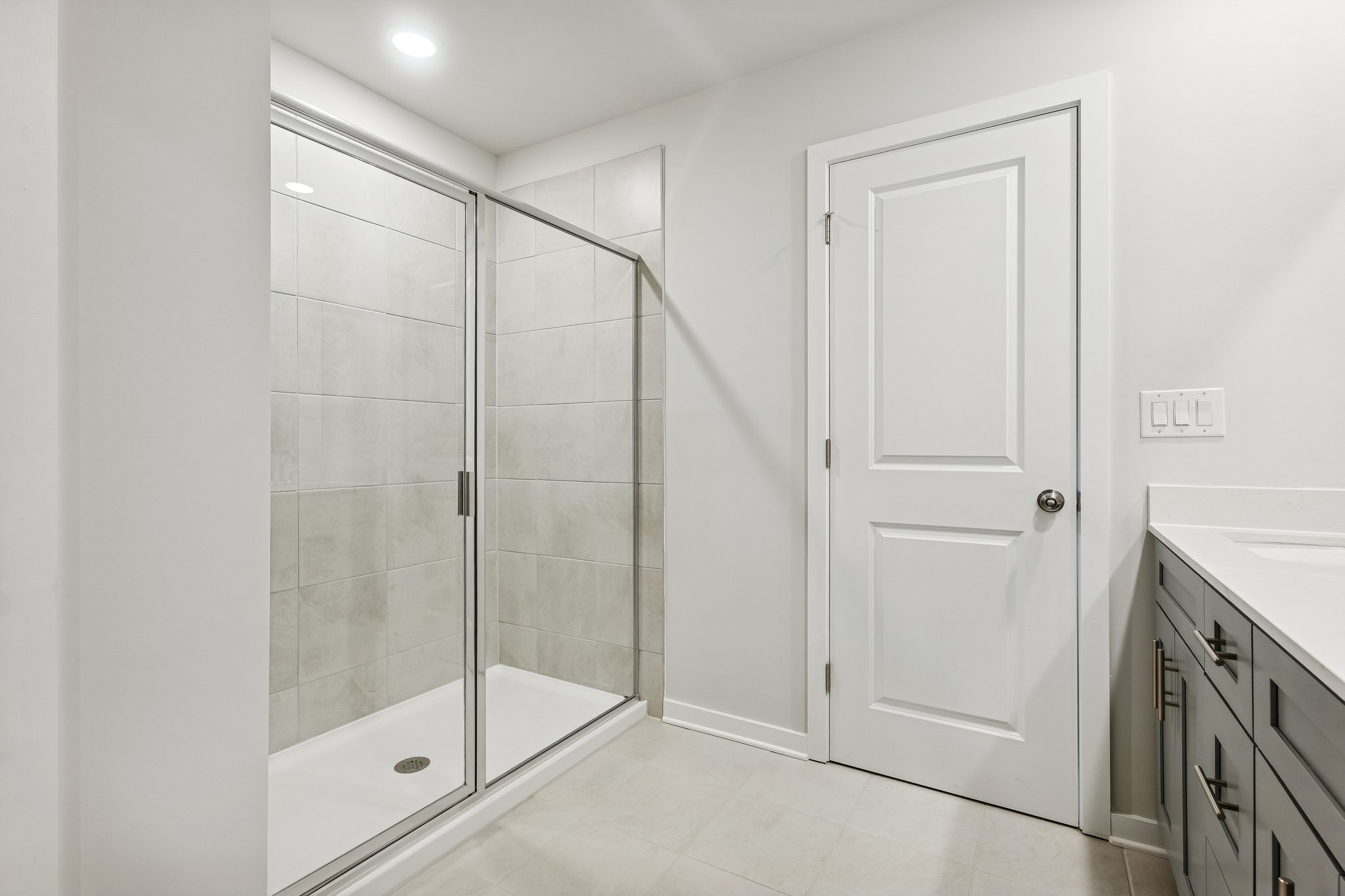A bathroom with a glass shower.