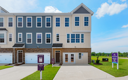 A building with a sign in front.