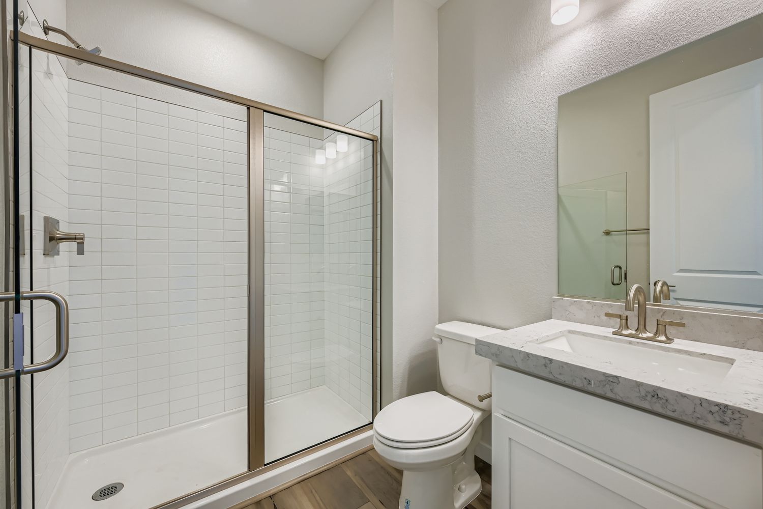 A bathroom with a glass shower.