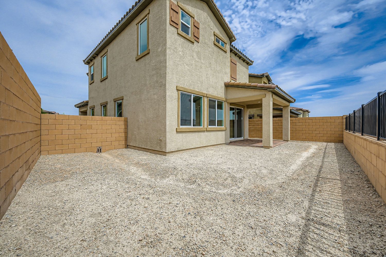 A building with a large front yard.
