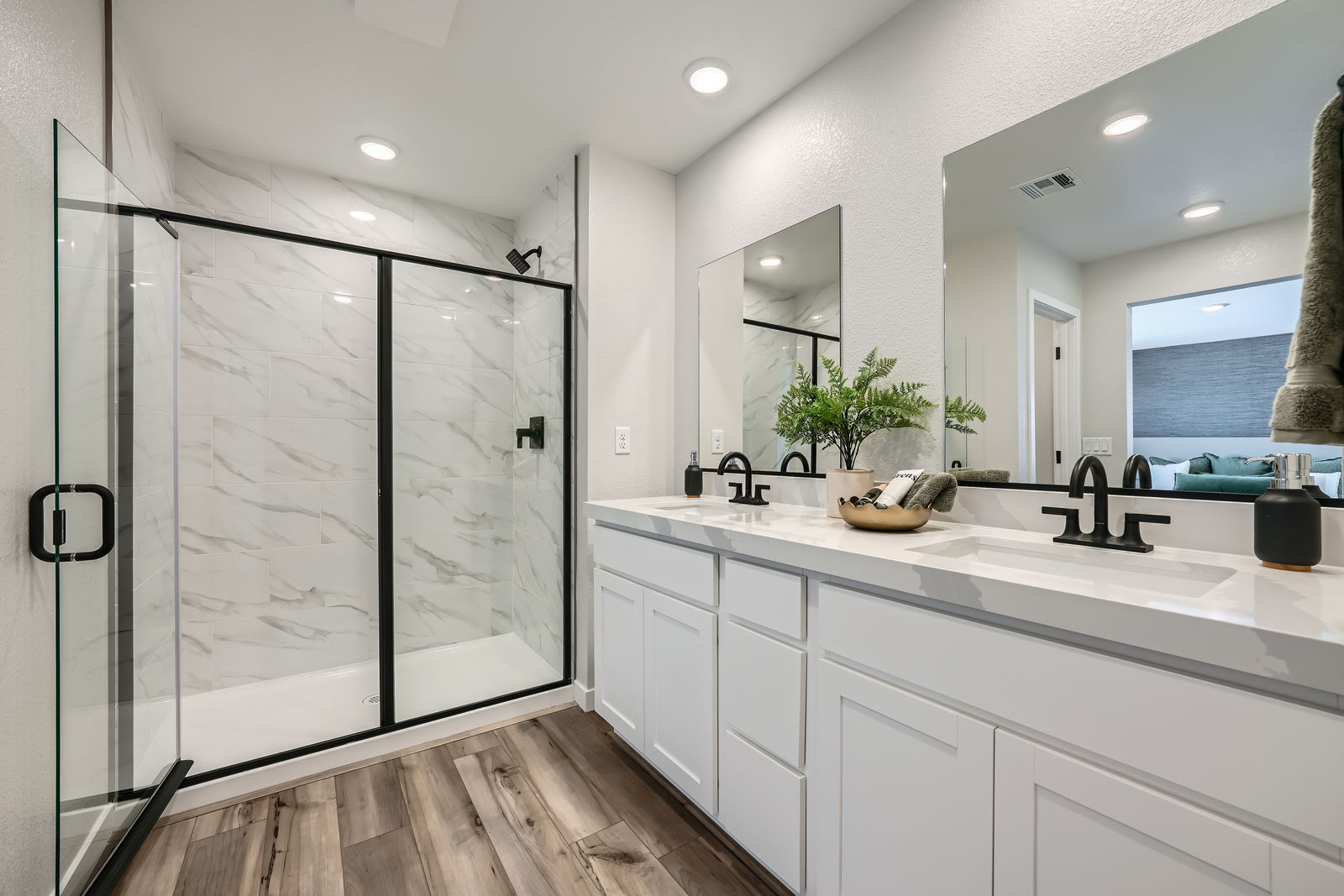 A bathroom with a glass shower.