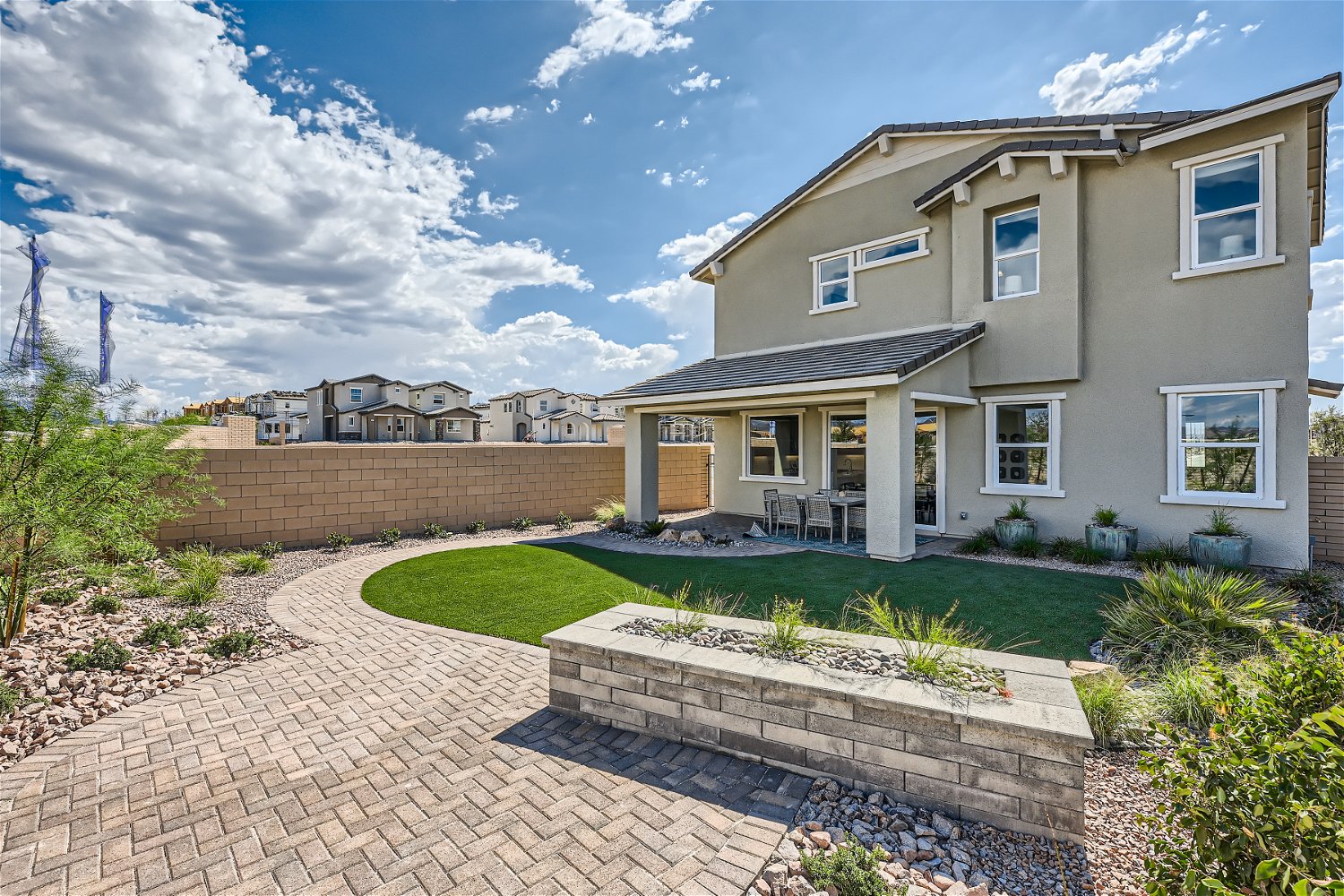 A house with a brick driveway.