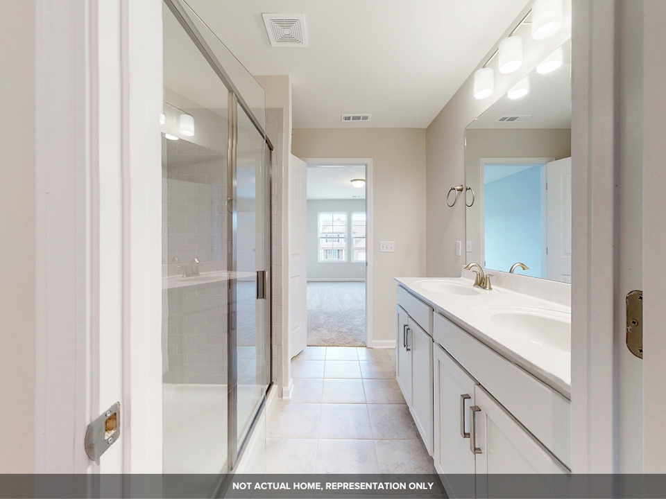 A bathroom with a glass shower.