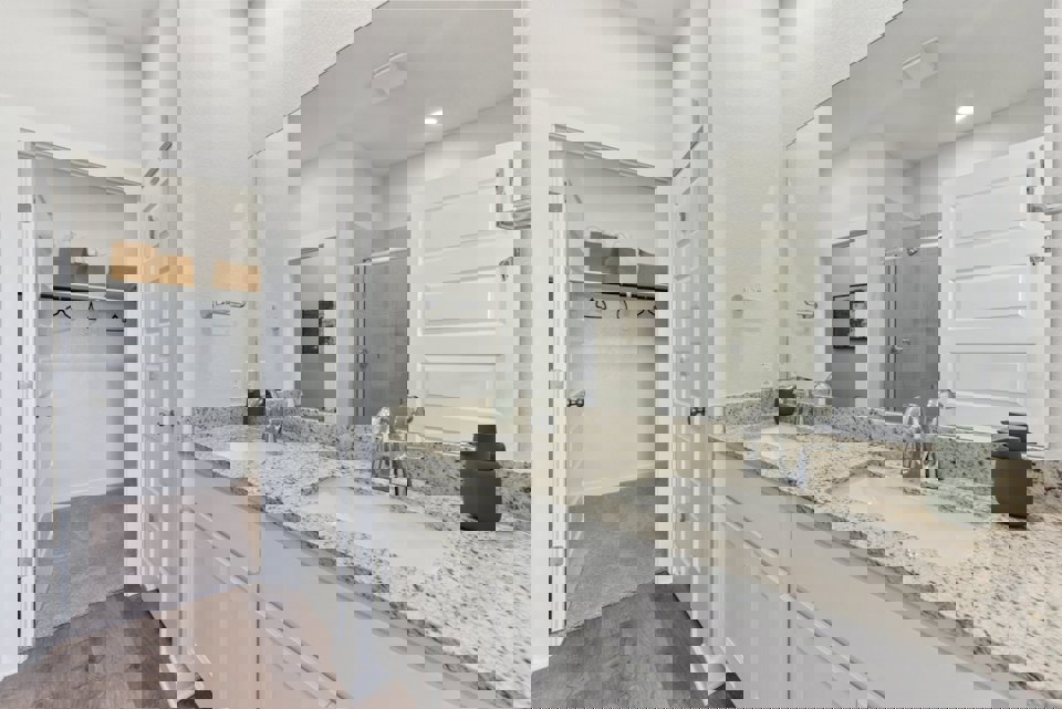 A bathroom with a marble countertop.