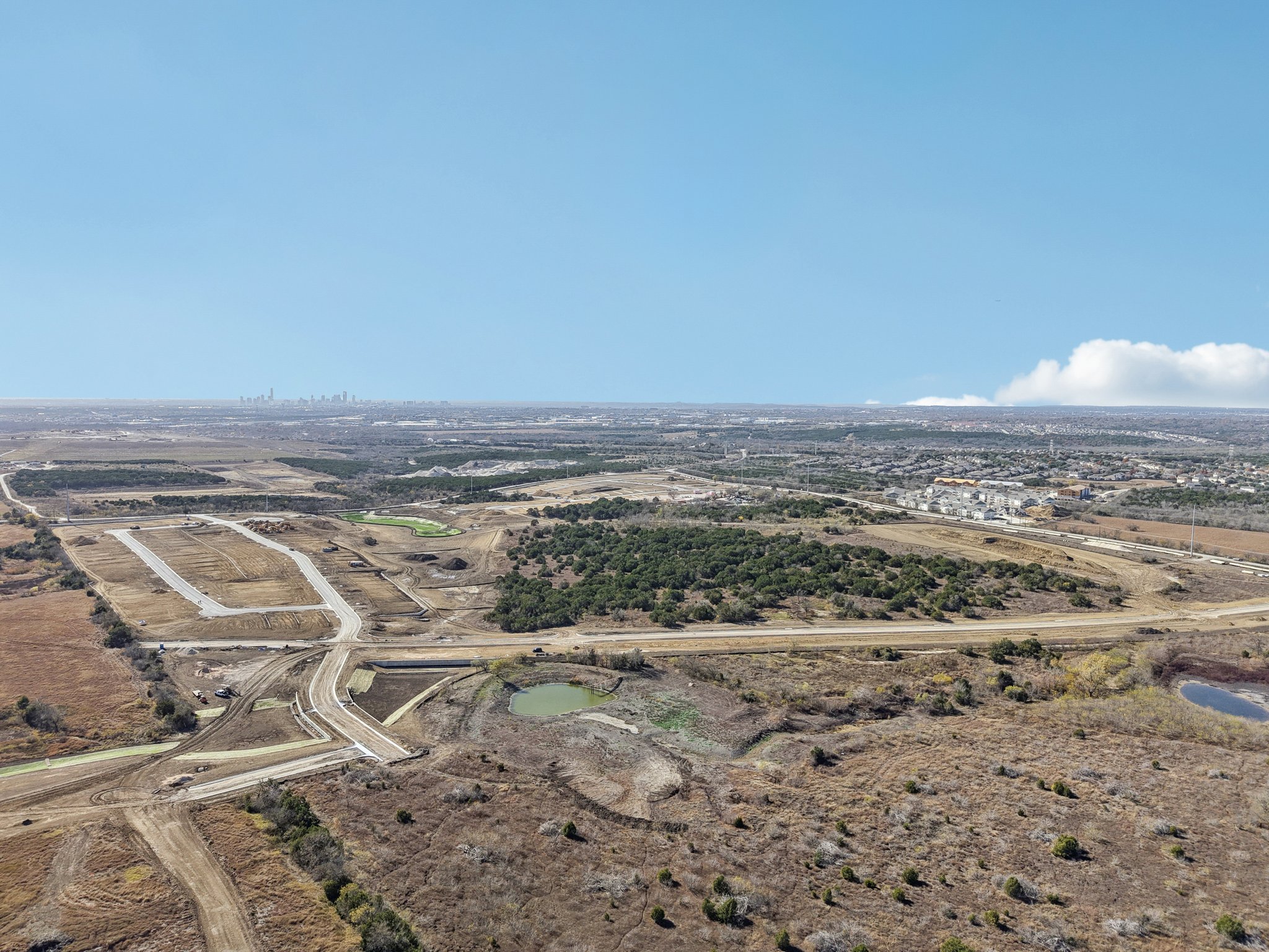 A landscape with a road and trees.