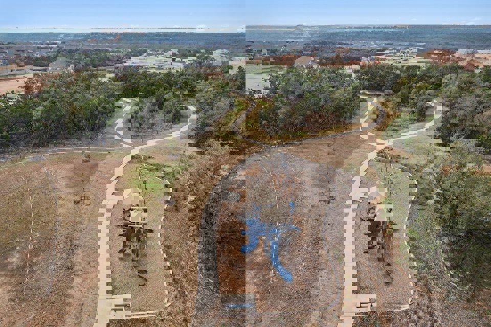 A small play structure in a field.