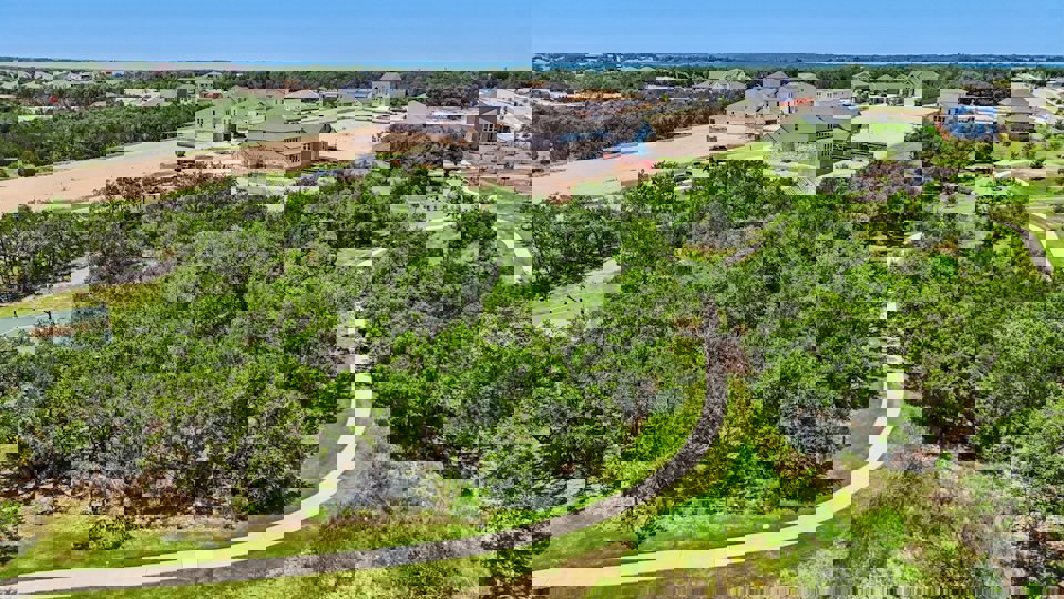 A group of houses in a wooded area.