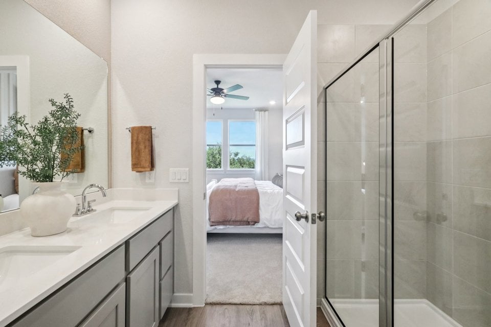 A bathroom with a glass shower.
