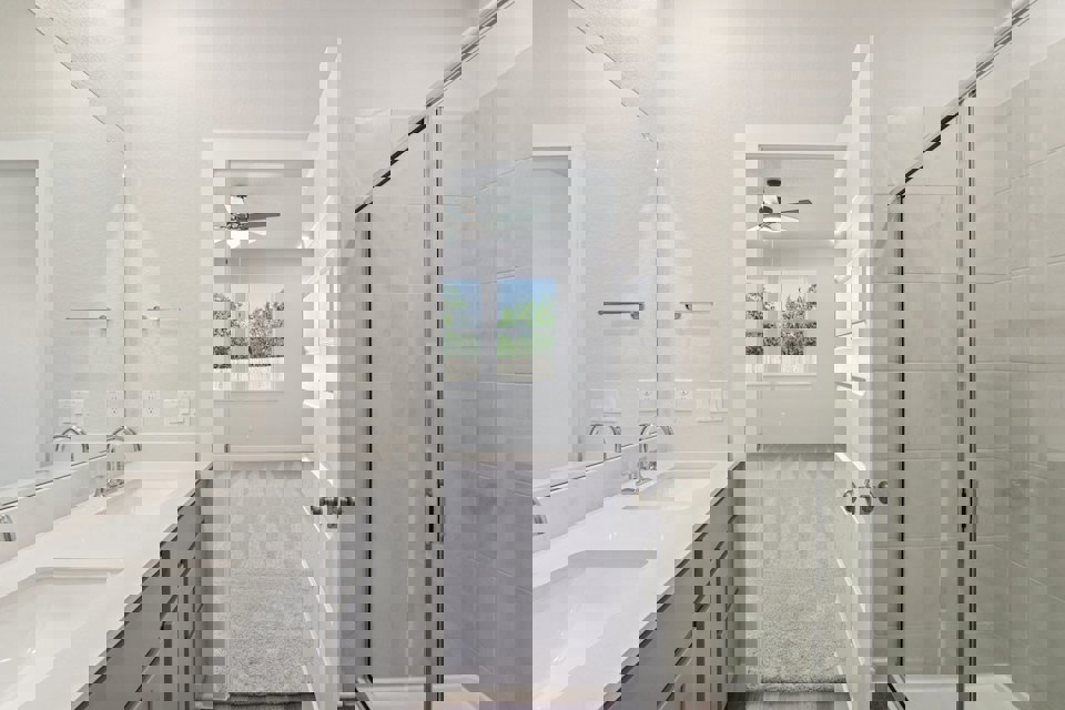 A bathroom with a glass shower.