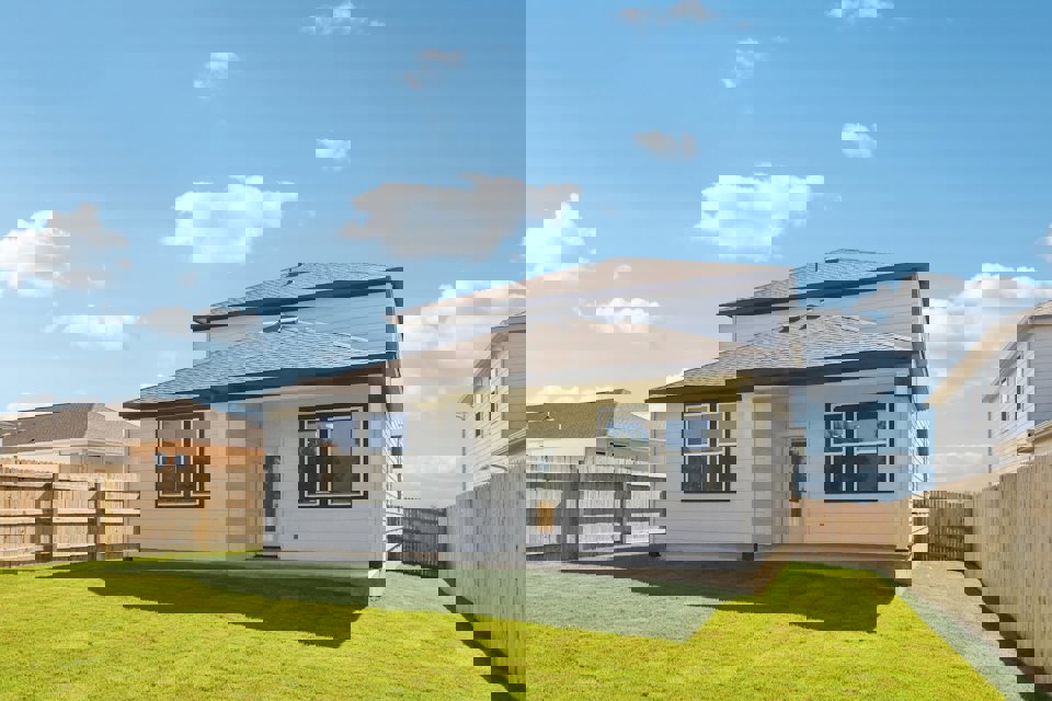 A house with a grass yard.