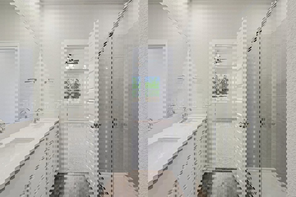 A bathroom with a glass shower.