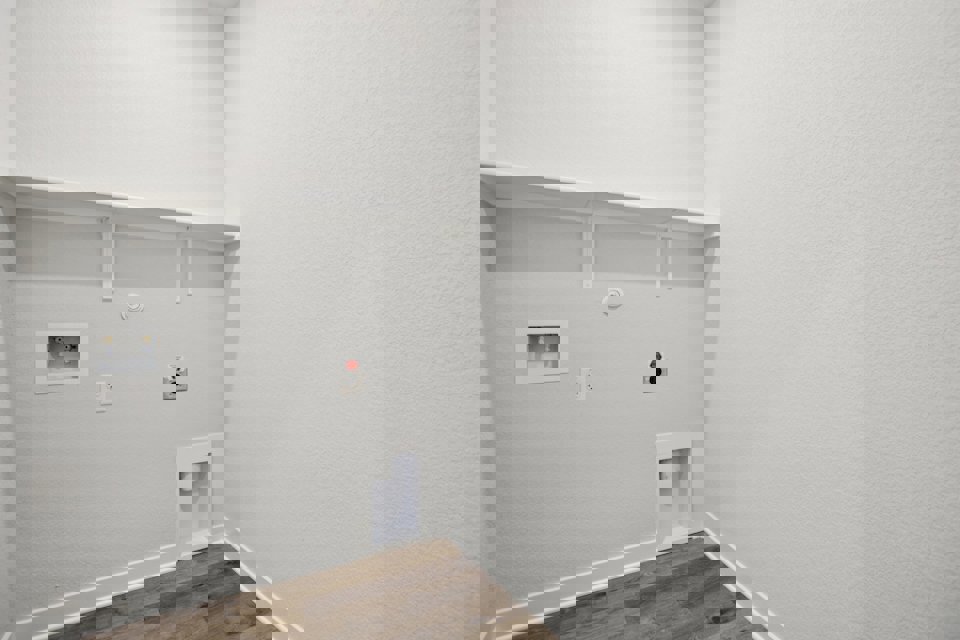 A white wall with a light on it.