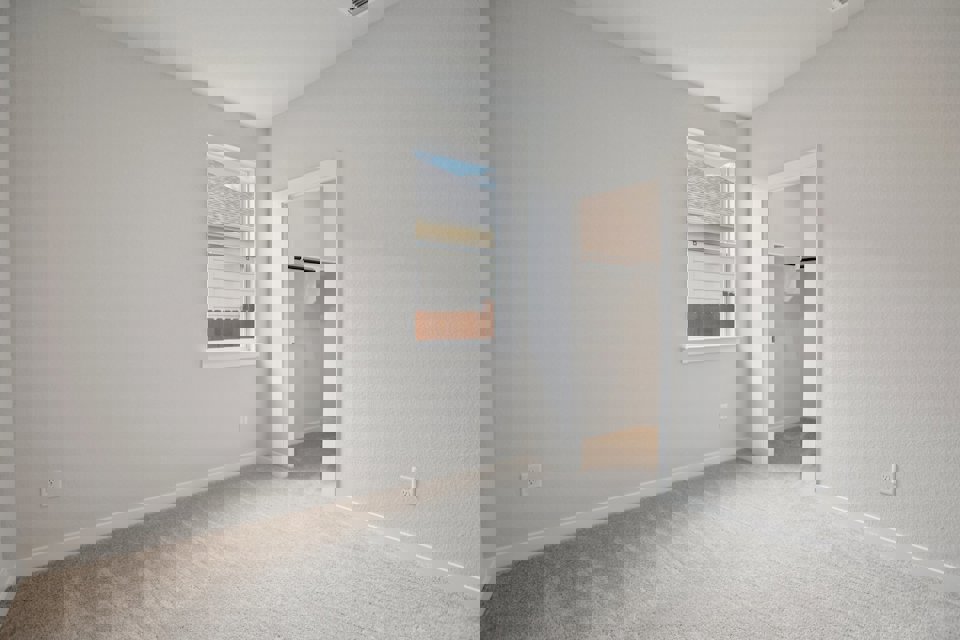 A room with a window and a door.