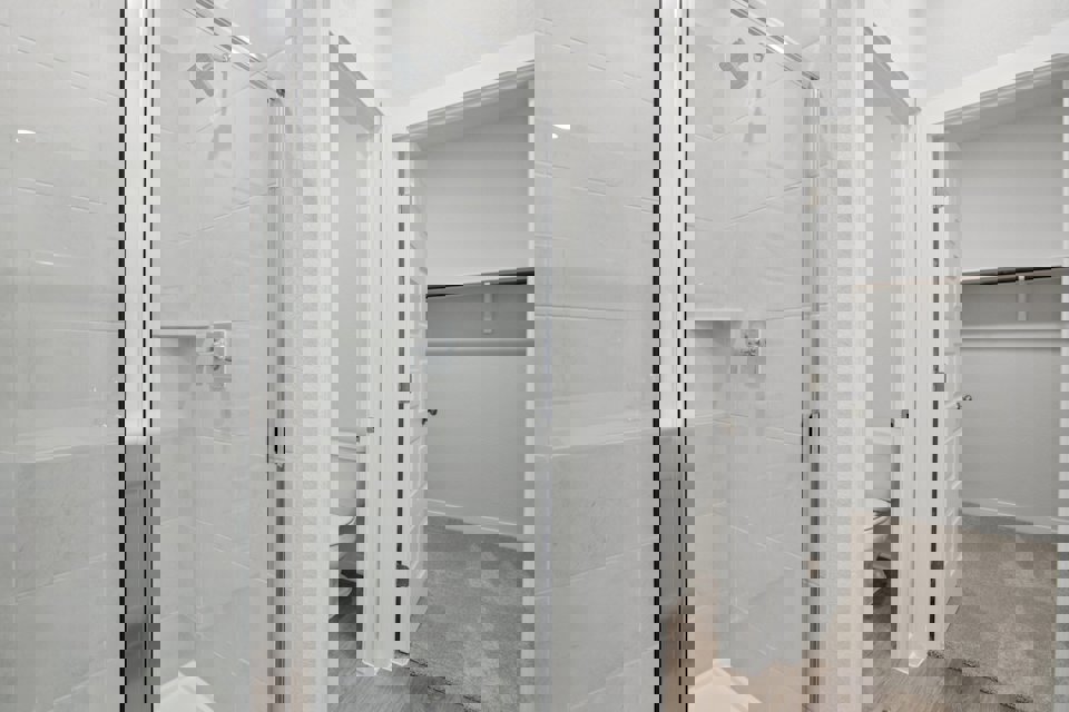 A bathroom with a glass shower.