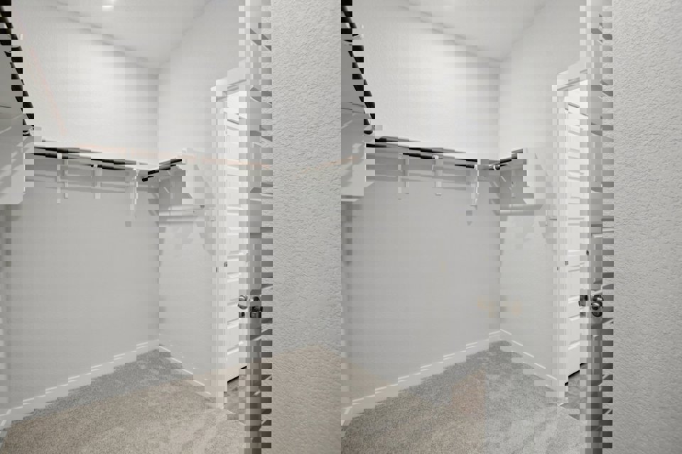 A hallway with white doors.