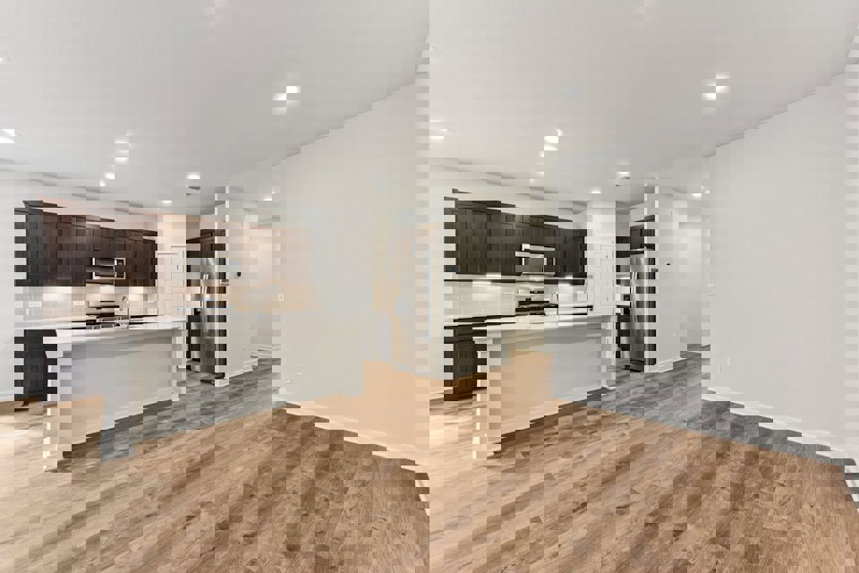 A kitchen with wooden floors.