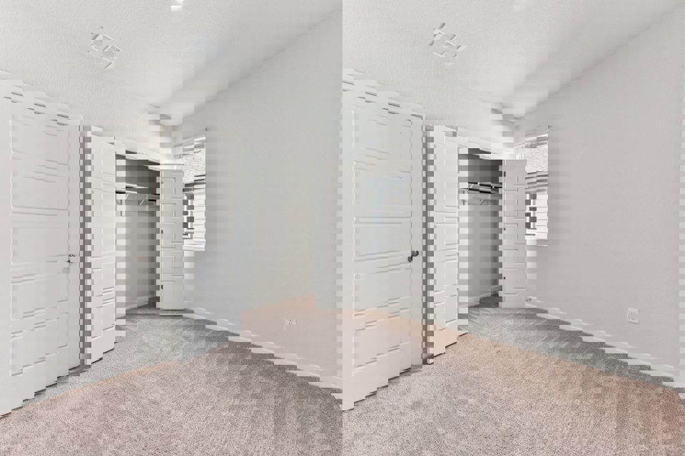 A room with white cabinets.