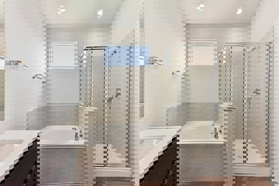 A bathroom with a glass shower.