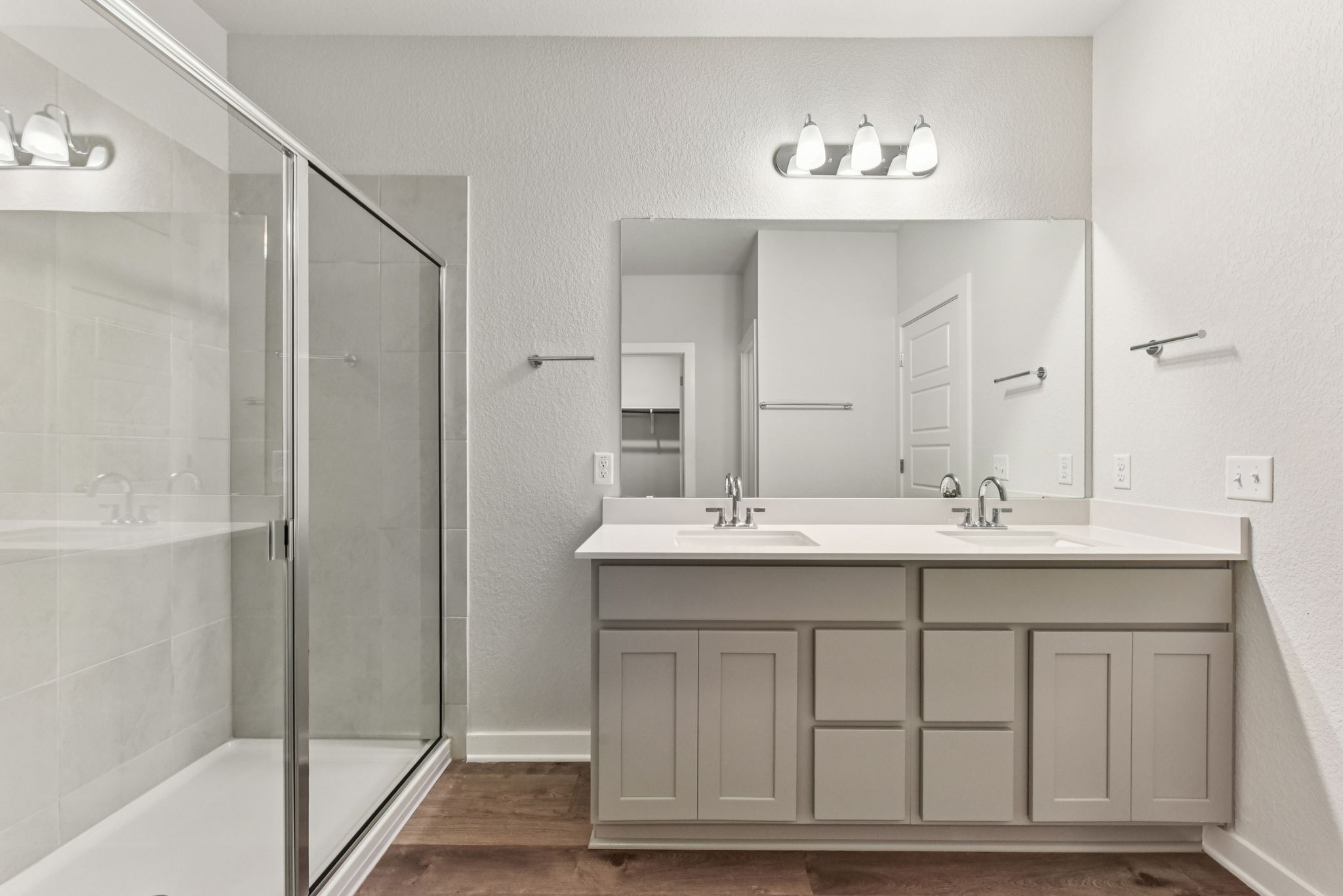 A bathroom with a glass shower.