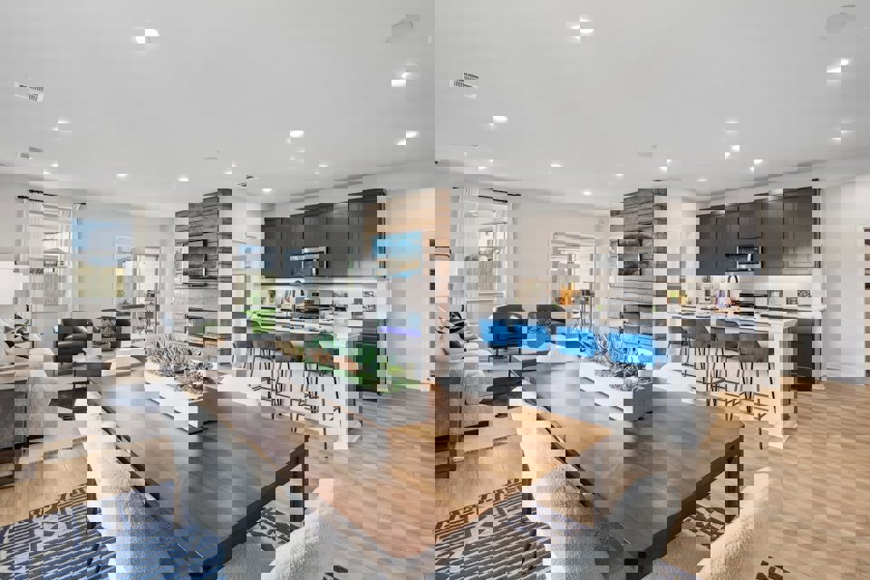 A large kitchen with a dining table.