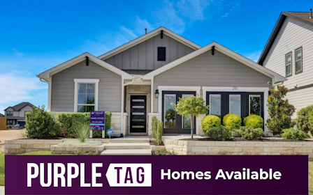 A house with a sign in front.