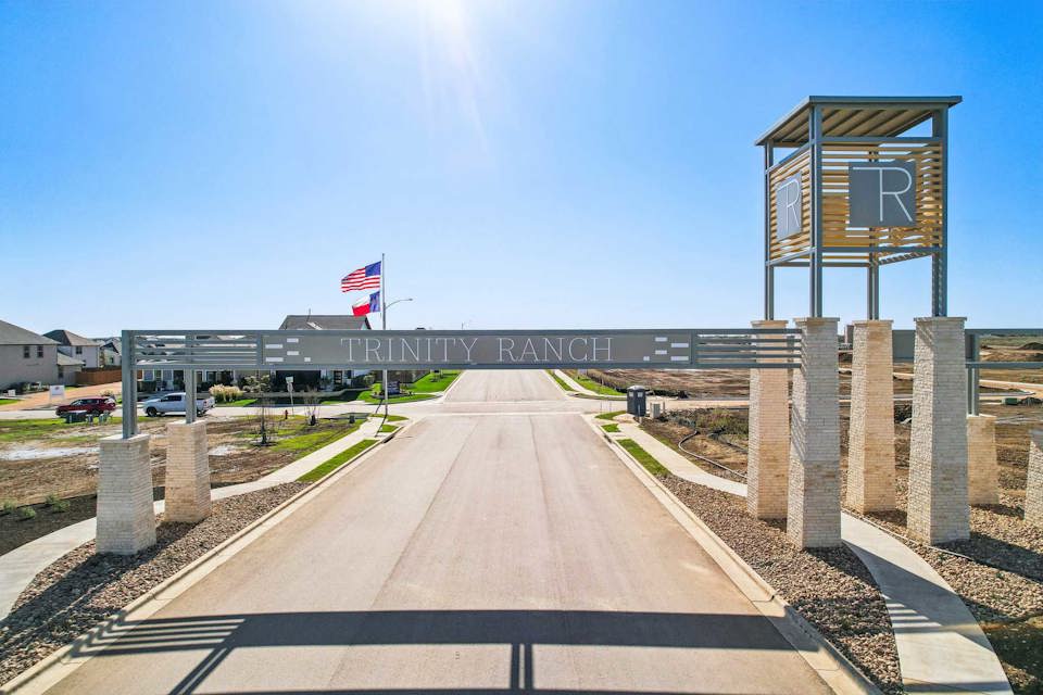A road with a sign and flags.