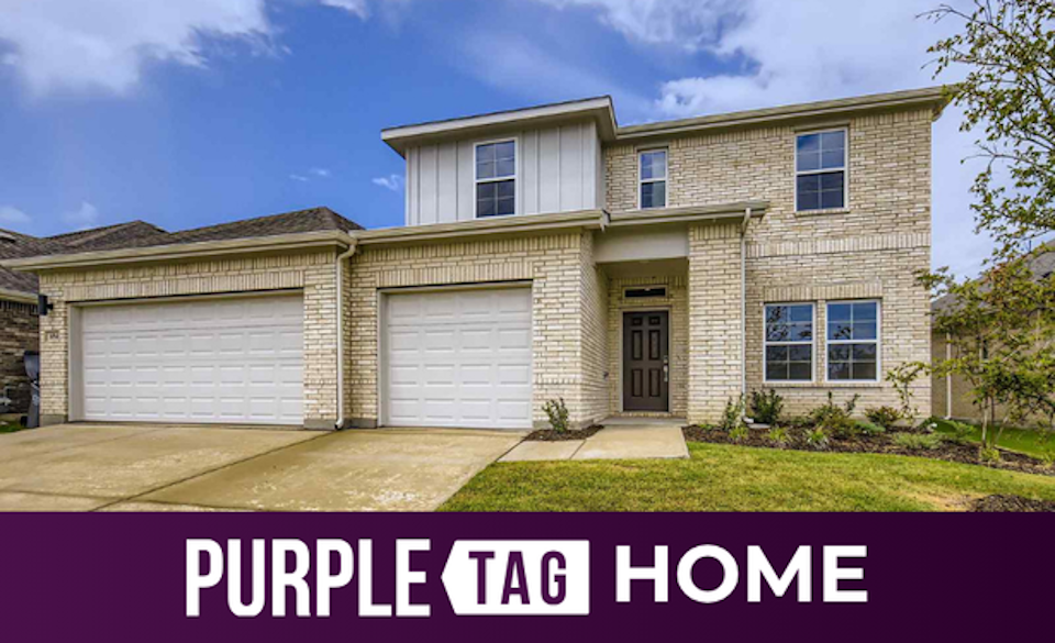 A house with garages and a driveway.