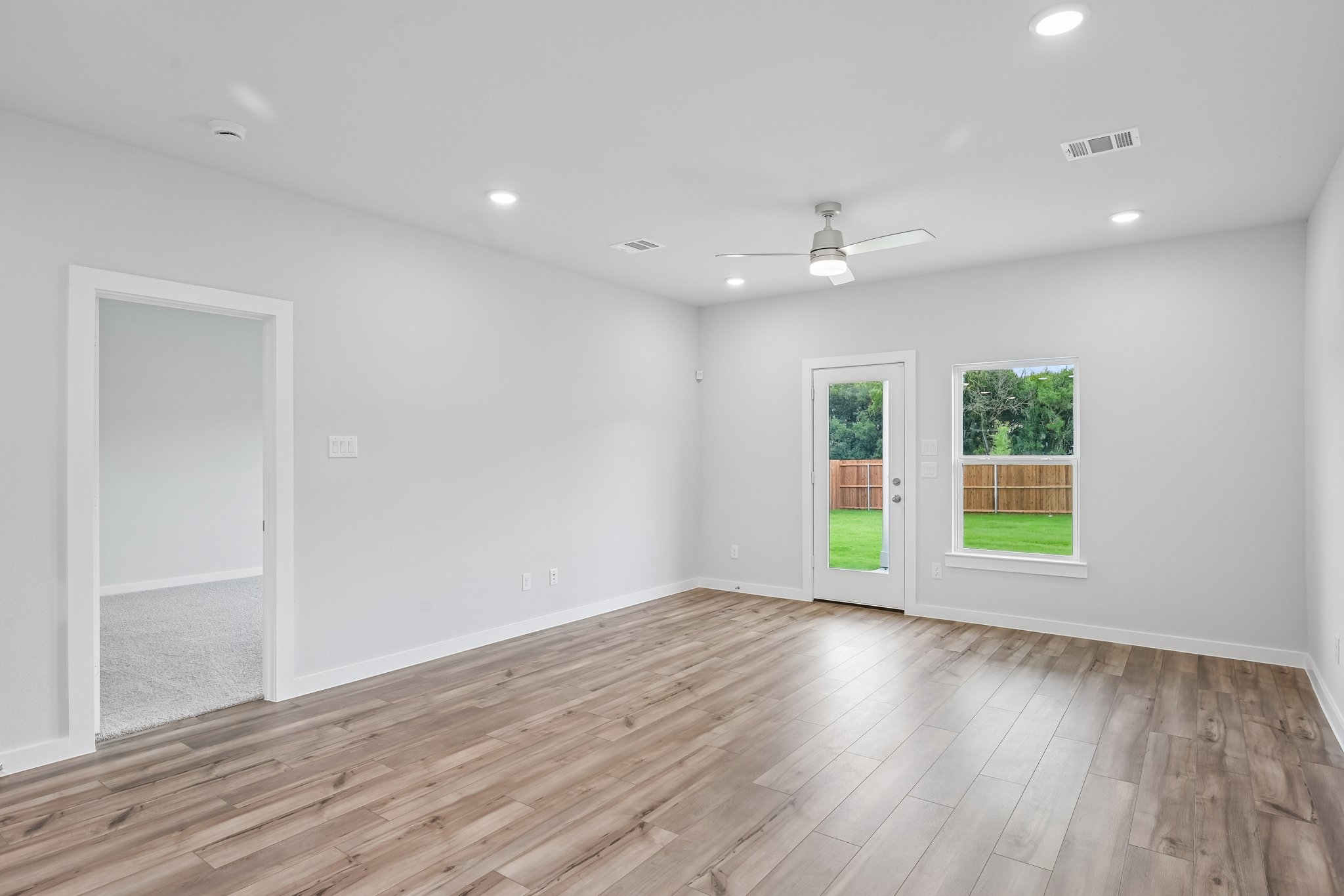A room with a wood floor and a wood floor with a wood floor.
