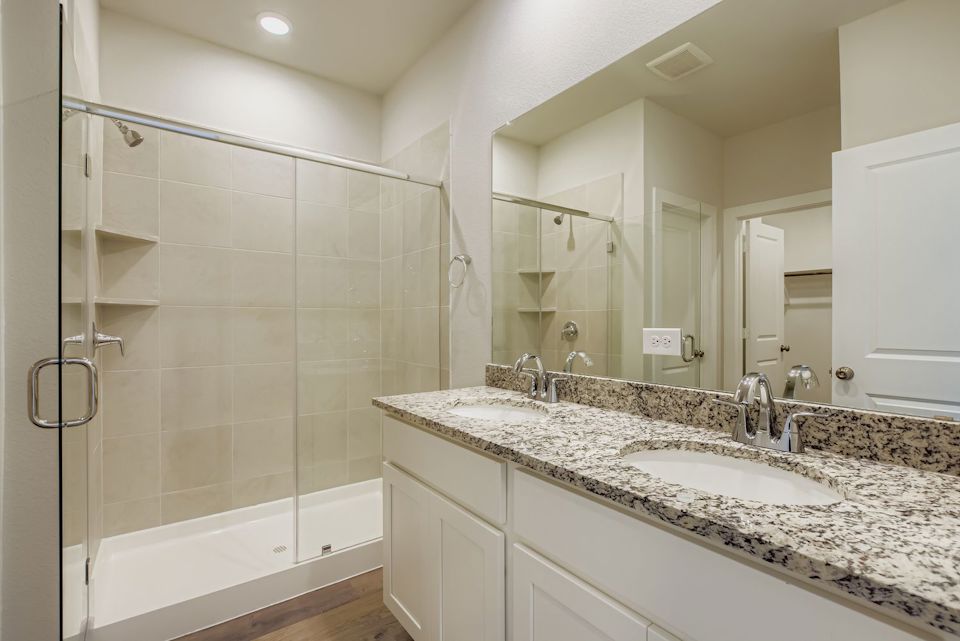 A bathroom with a marble countertop.