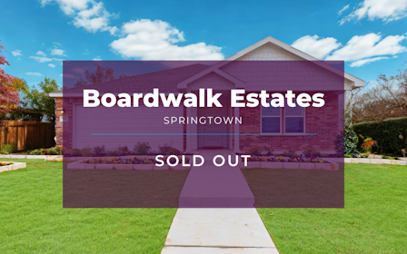 A building with a sign in front of it.