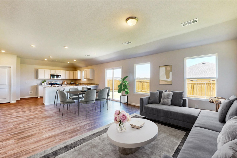 A large living room with a large kitchen and dining area.