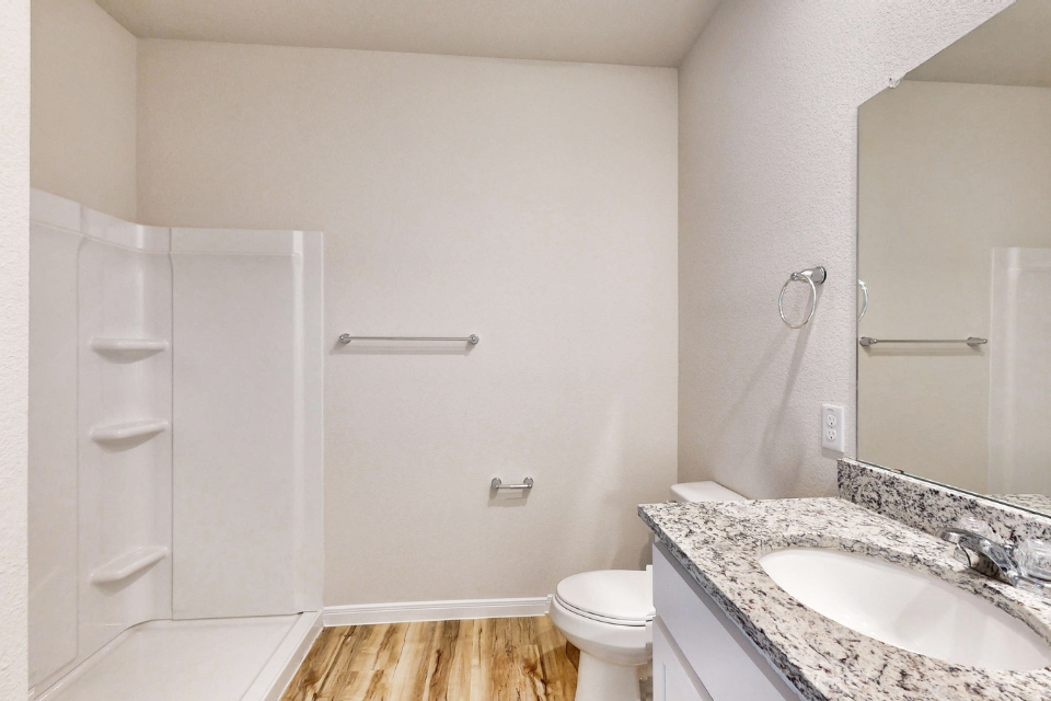 A bathroom with a sink and a toilet.
