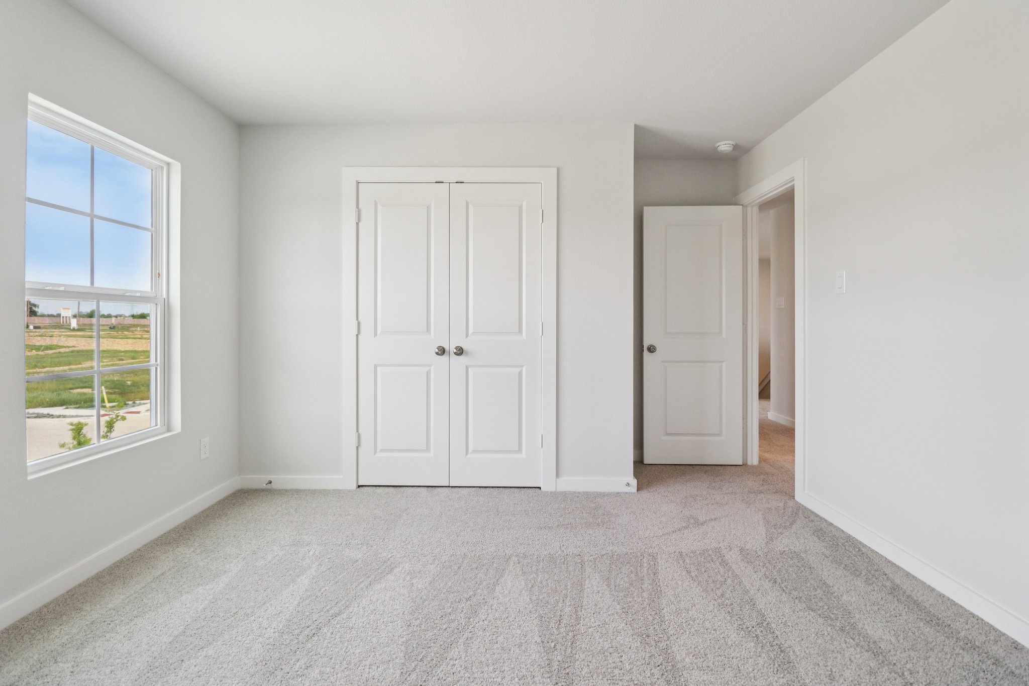 A room with white doors.