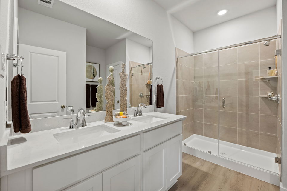 A bathroom with a glass shower.
