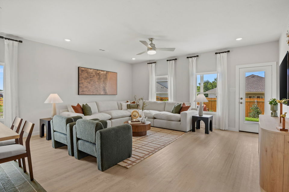 A living room with a wood floor.