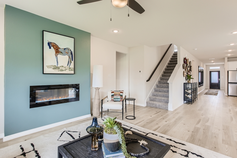 A large living room with a staircase.