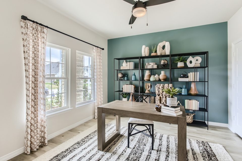 A room with a table and shelves.