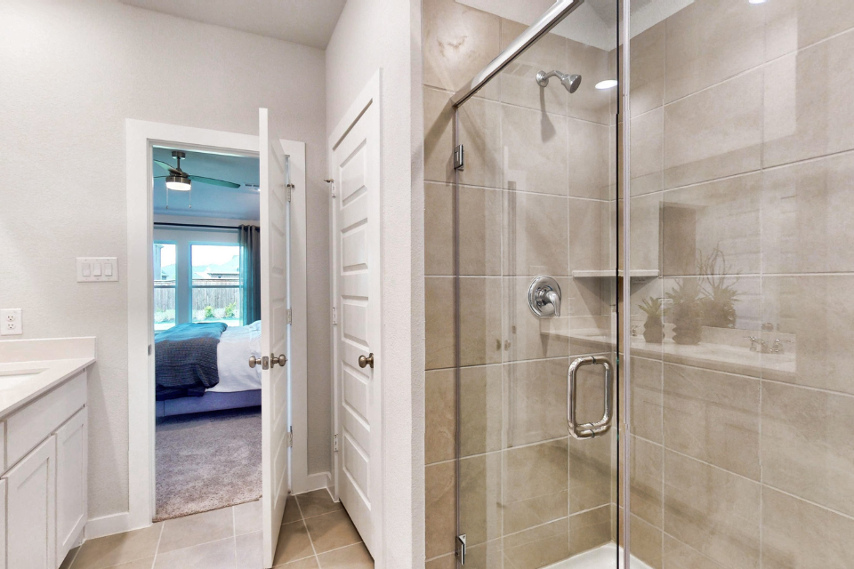 A bathroom with a glass shower.