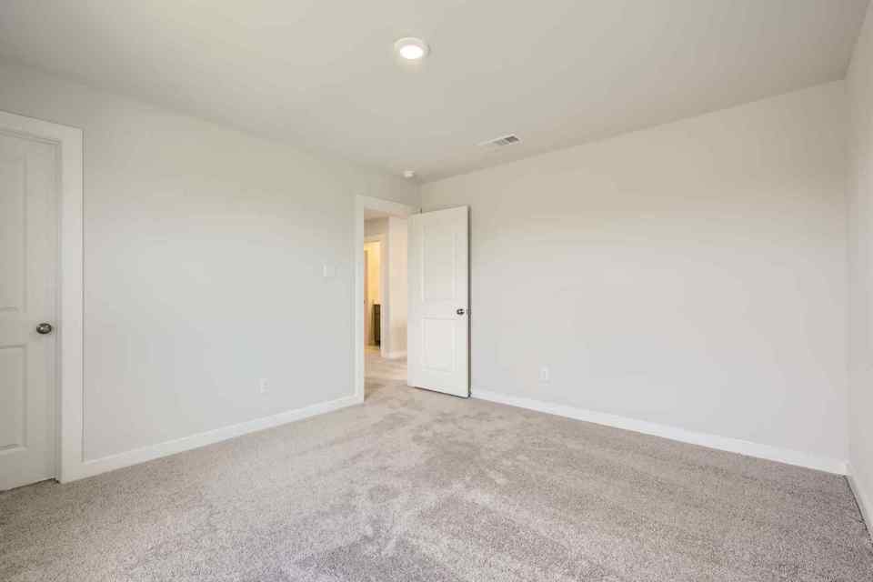 A hallway with white doors.
