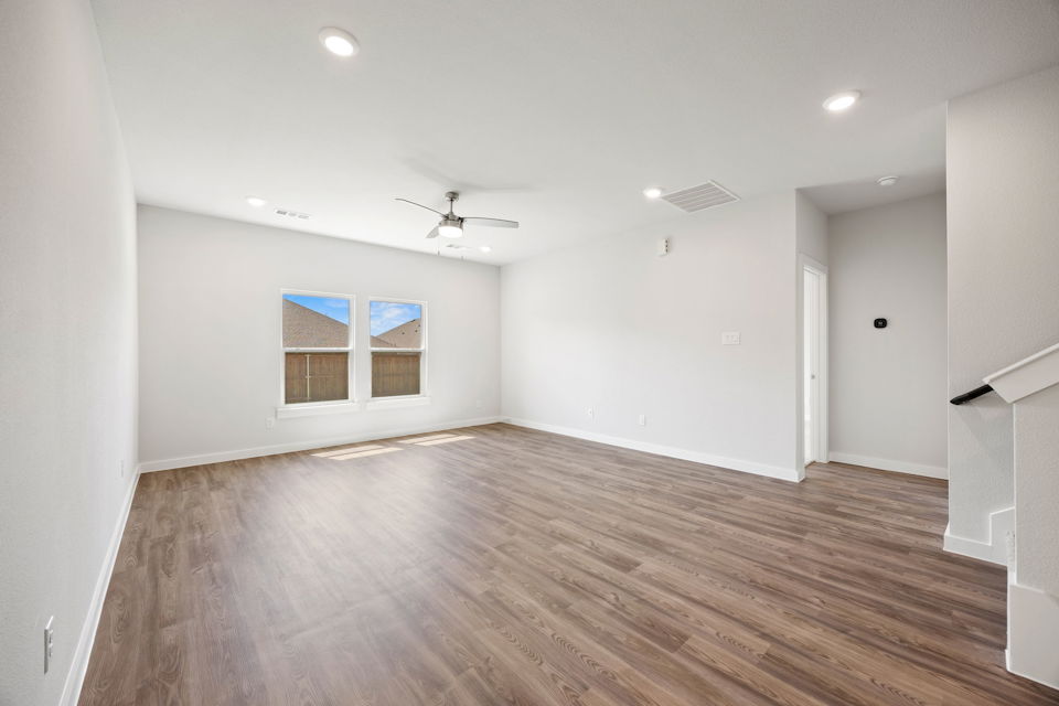 A room with a wood floor and a wood floor.