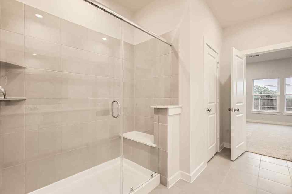 A bathroom with a glass shower.