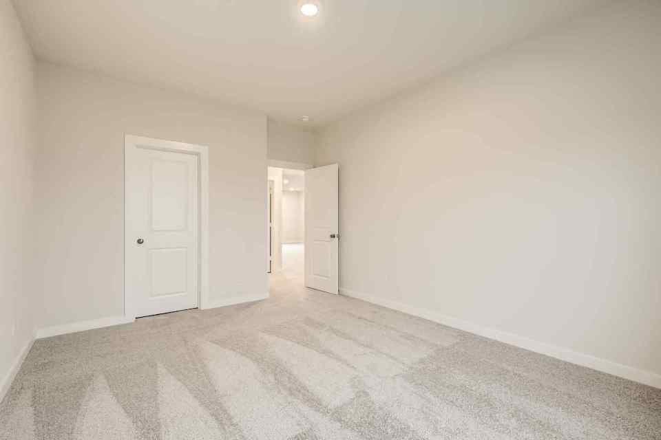A hallway with white doors.