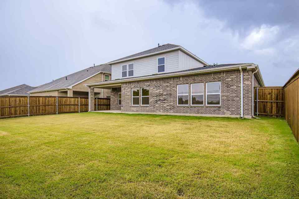 A house with a fence around it.